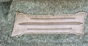 buttonhole, sewn on the usual longitudinal line
